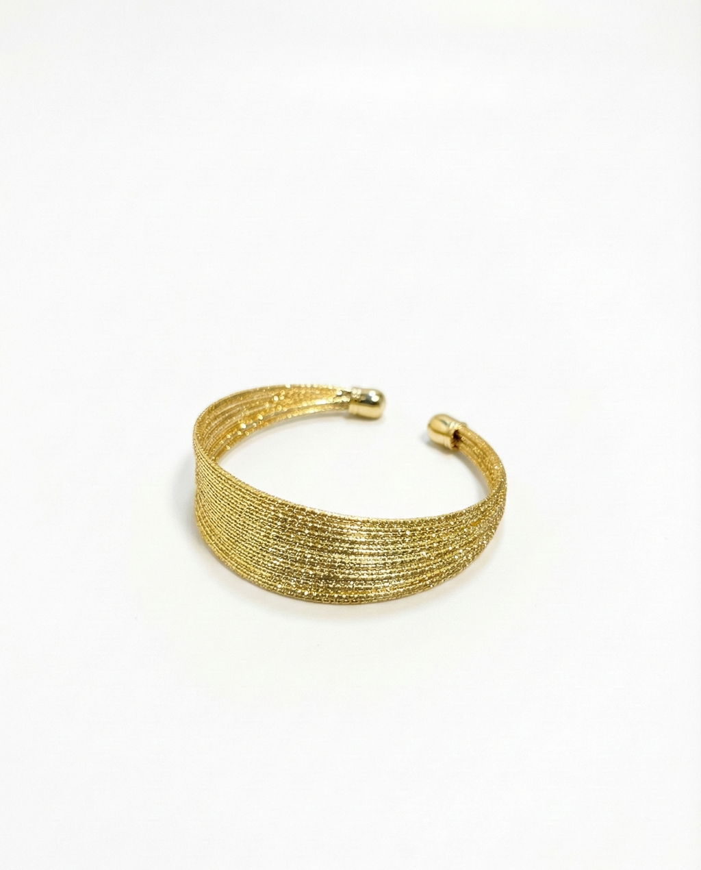 Gold bracelet on a white background