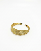 Gold bracelet on a white background