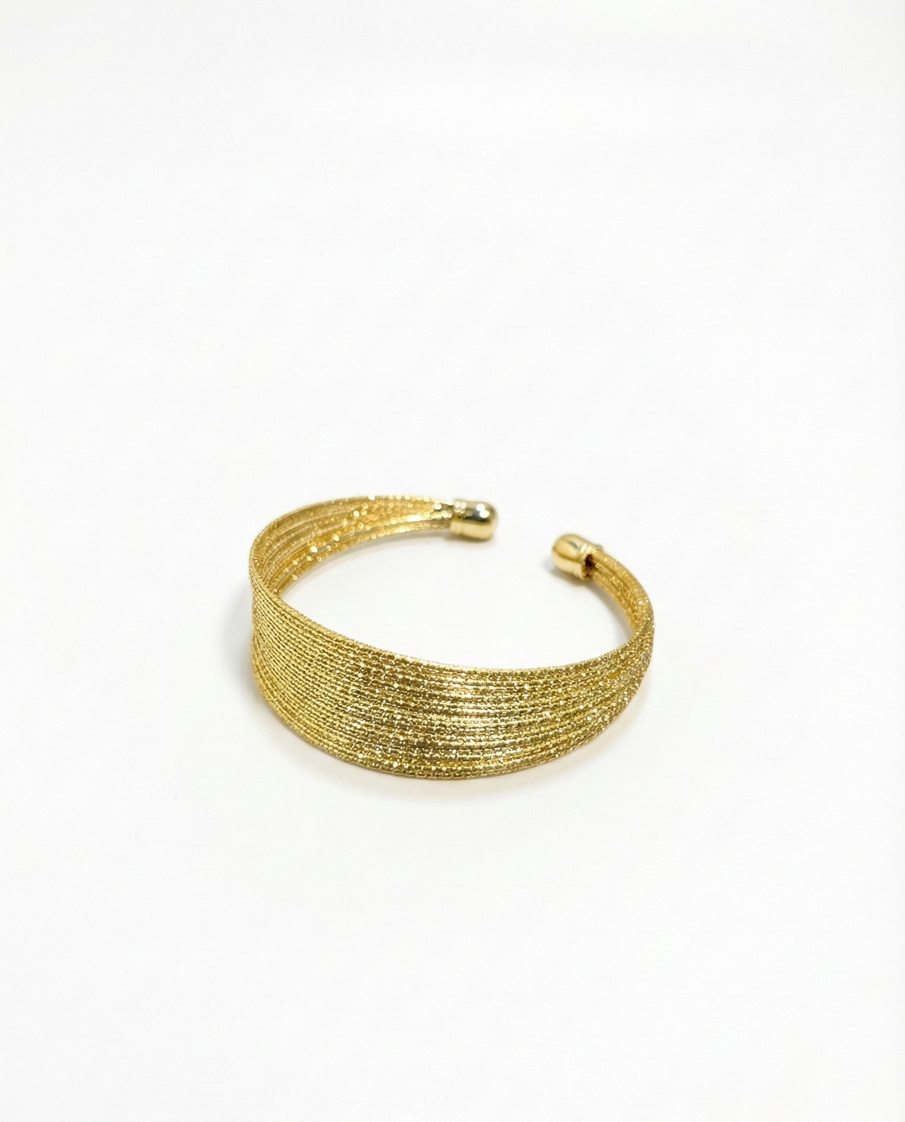 Gold bracelet on a white background