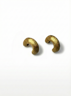 Two gold beads on a white background