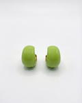 Pair of green earrings on a white background