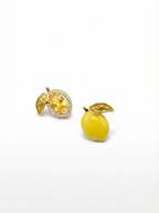Two yellow earrings on a white background
