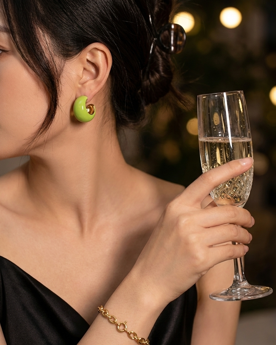 Woman holding a glass of champagne with a blurred background