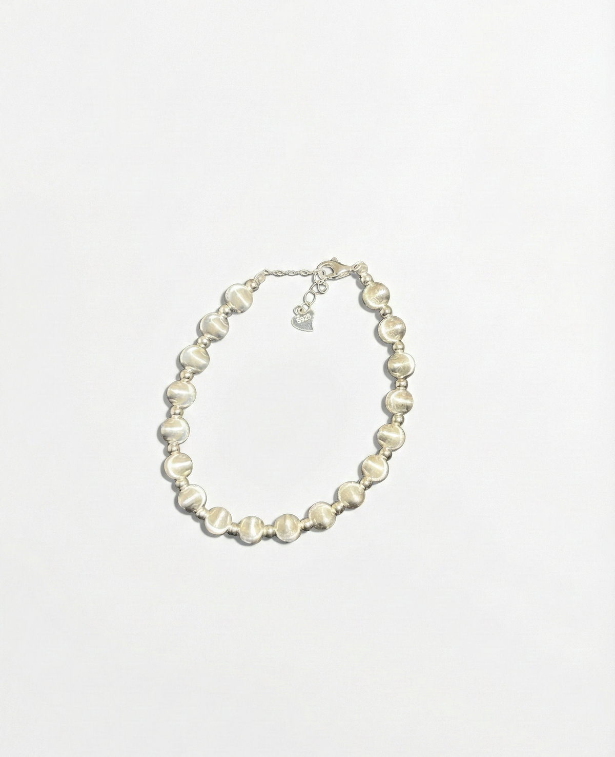 Pearl necklace on a white background by SFUMATO