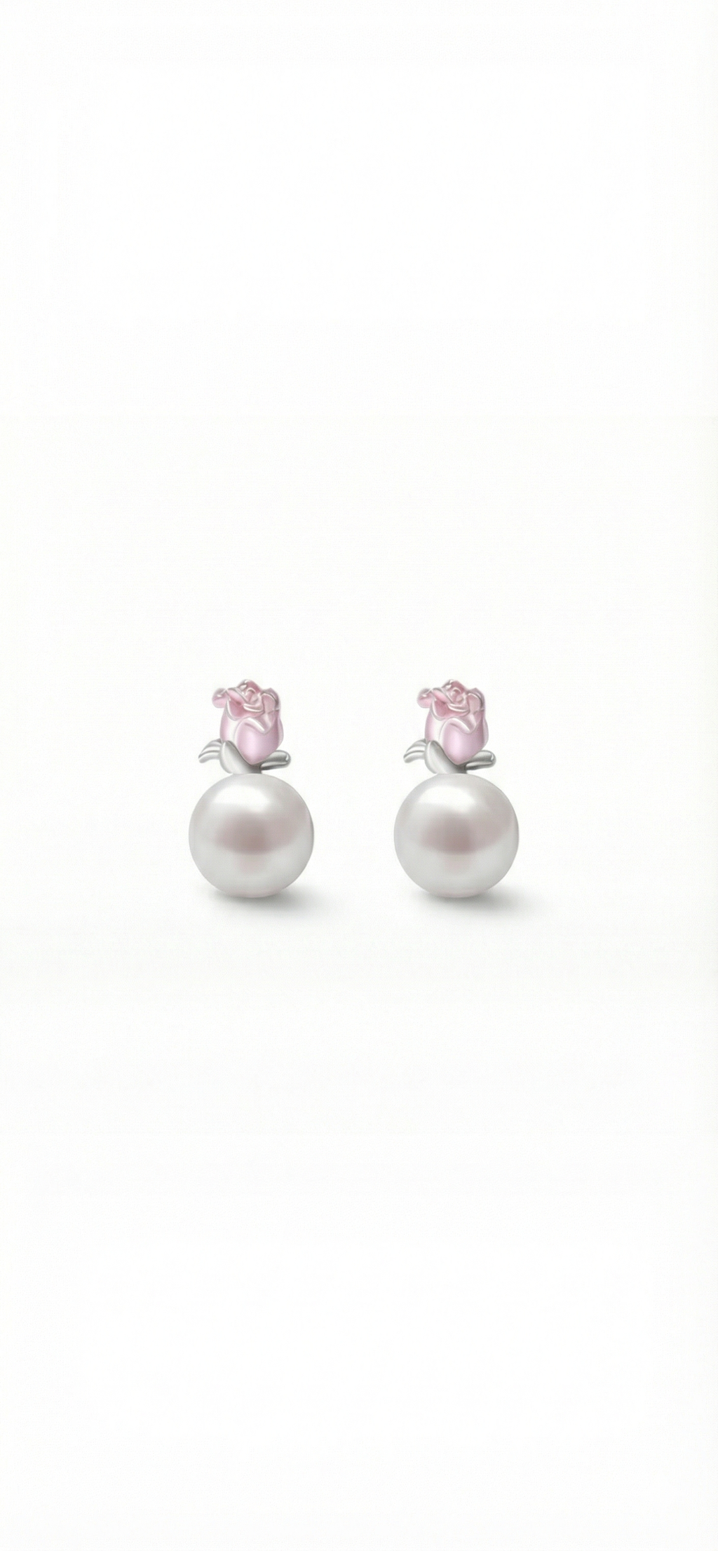 Pair of pearl earrings with pink gemstones on a white background
