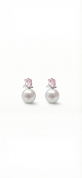 Pair of pearl earrings with pink gemstones on a white background